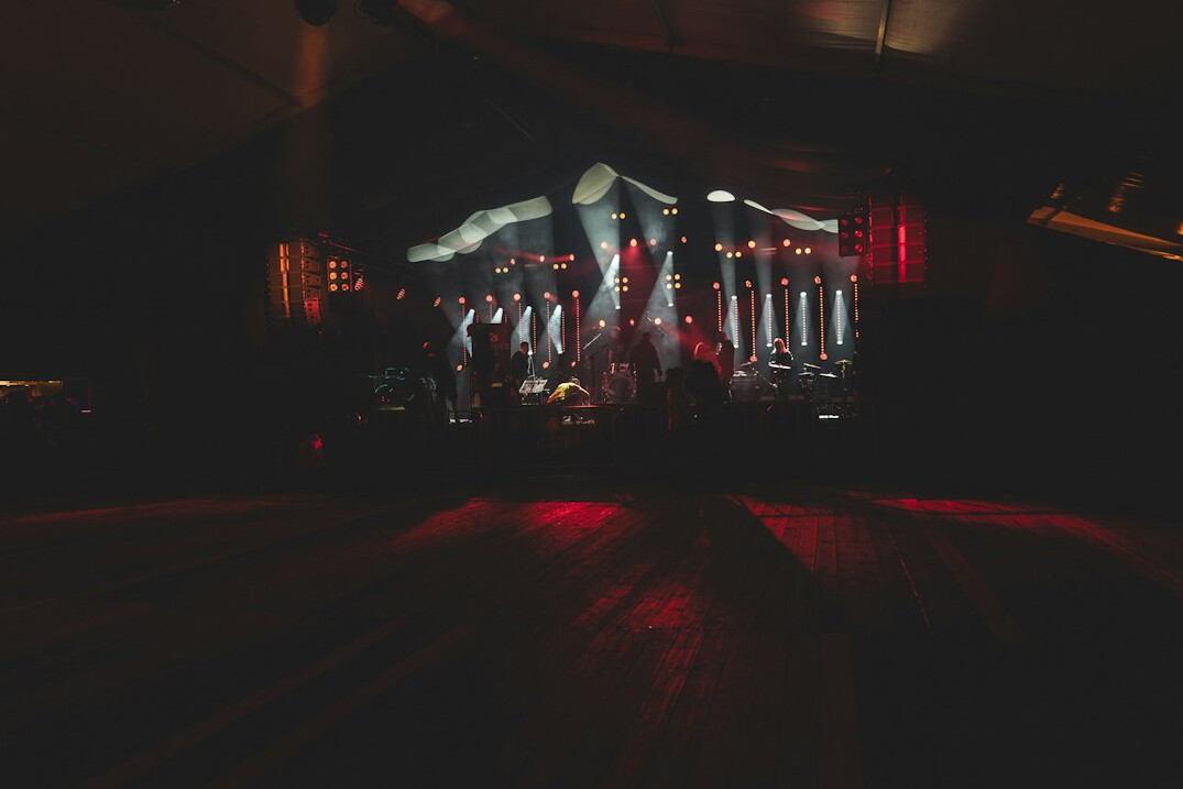 Corporate event stage with colorful lights and LED screen