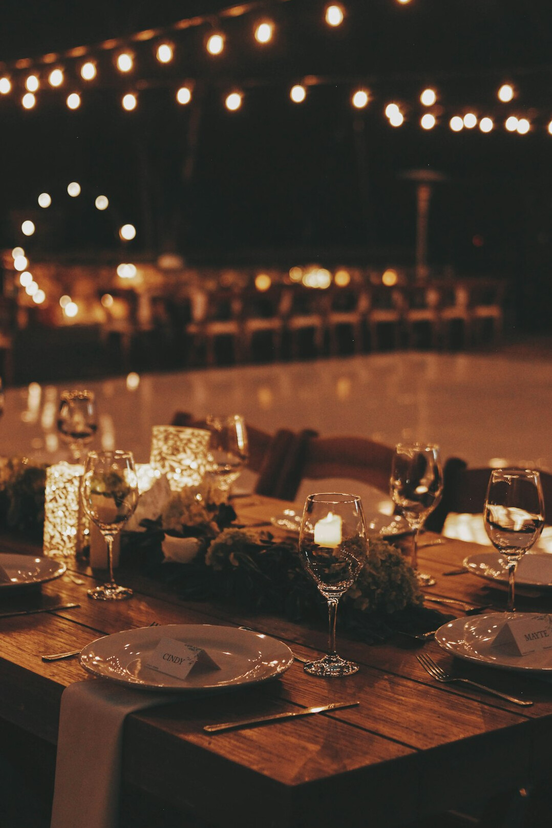 Elegant gala dinner venue with decorated tables and warm lights