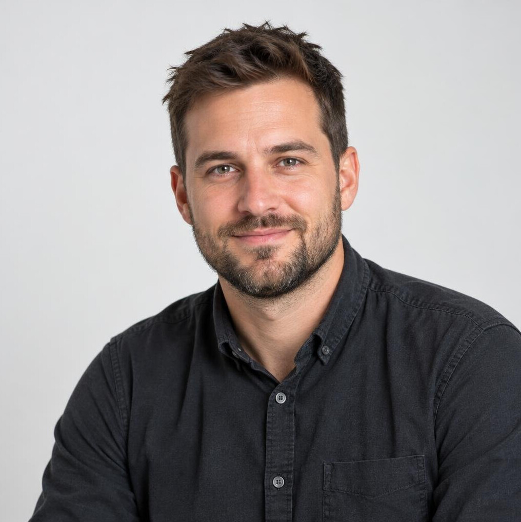 Portrait of a young man with a beard smiling